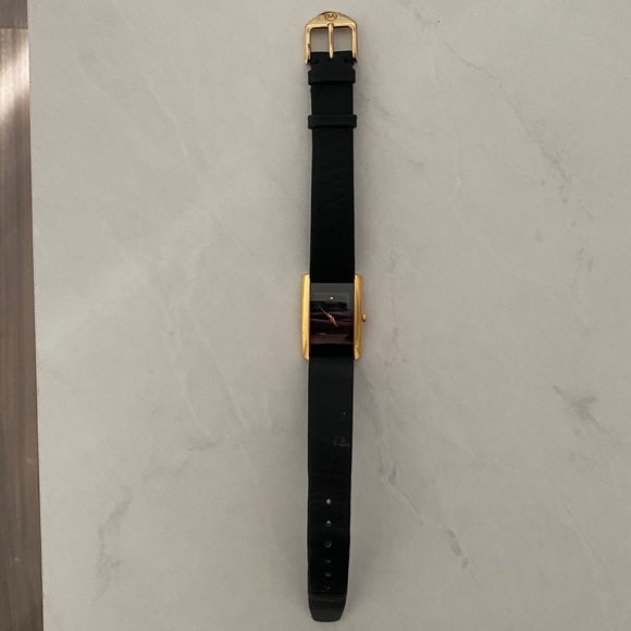 Movado gold and black rectangle watch
